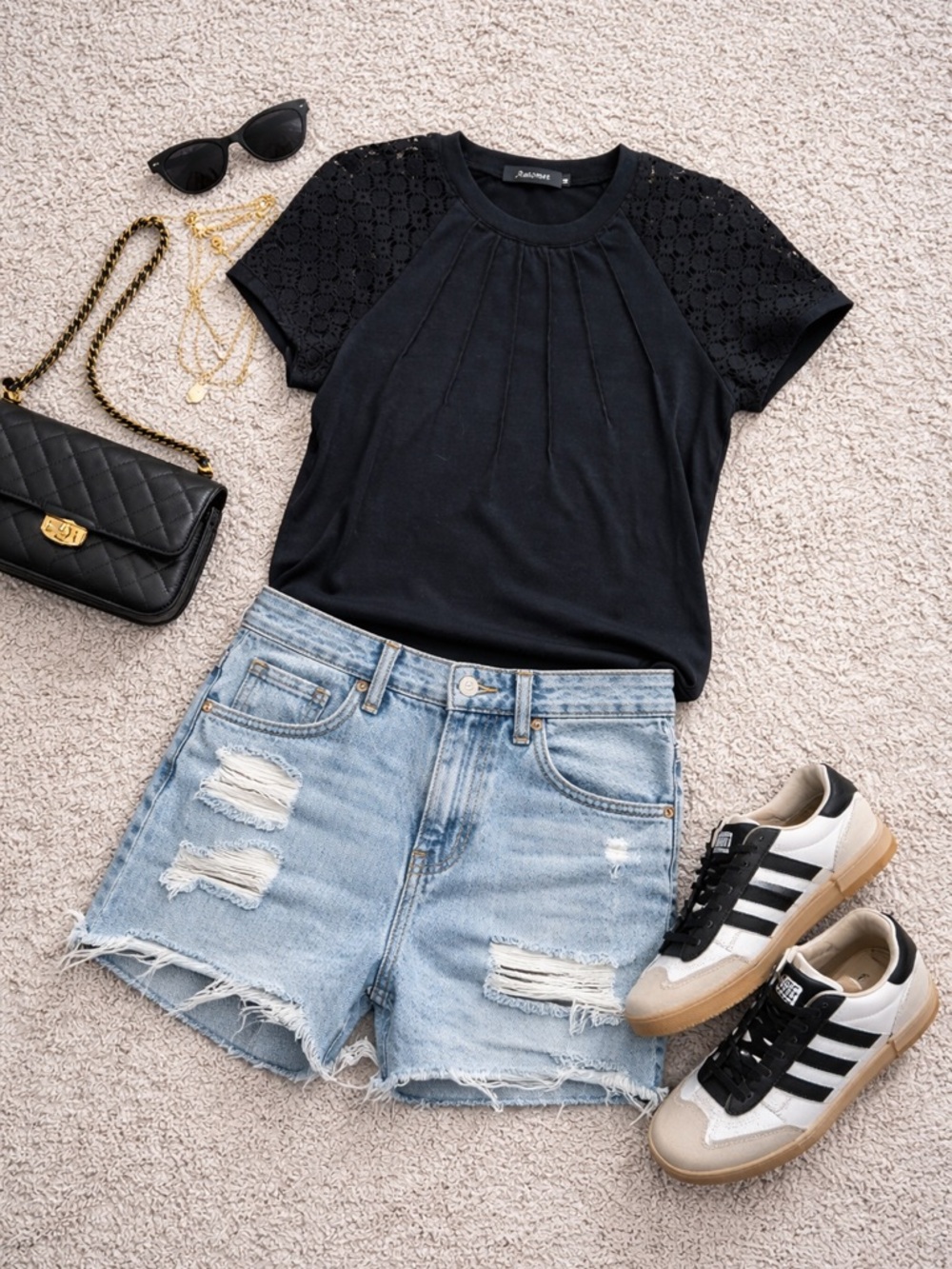 Elegant Black Pleated Blouse with Lace Sleeves